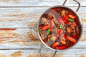 Beef tail stew with vegetables, thyme, red wine