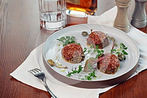 Above view of salmon tartar on a dark wooden background, studio shot