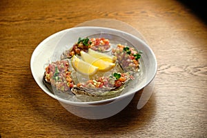 Beef tartar with salad and garlic toast on dark bread