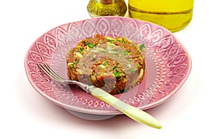 Beef Tartare cold appetizer of raw minced meat with egg yolk, spices, onions, olive oil, lemon juice