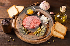 Beef tartare on wooden table