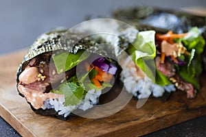 Beef temaki on the wooden board