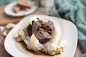 Beef tips with gravy on mashed potatoes