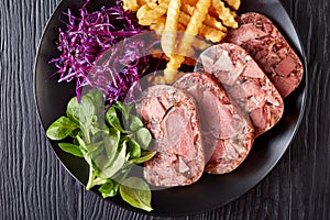 Beef tongue aspic with coleslaw and french fries