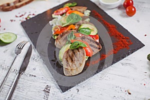 Beef tongue grilled with herbs and vegetables