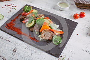 Beef tongue grilled with herbs and vegetables