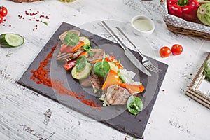 Beef tongue grilled with herbs and vegetables