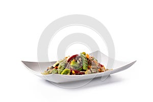 Beef, vegetables and sesame seeds in white plate