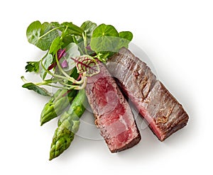 Beef wagyu steak meat with herbs and asparagus isolated on wight background