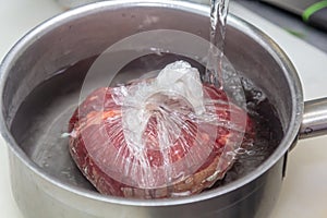 Beefsteak or beef shank in vacuumed package. Sous-vide