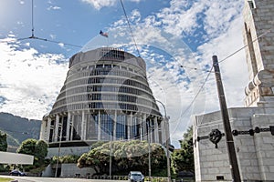 Beehive government building flying New Zealand flag at half mast