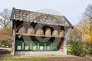 Beehives and hives outside under roof