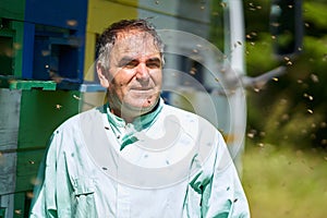 Beekeeper checking his hives