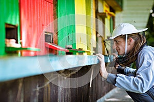 Beekeeper observing carefully his bees