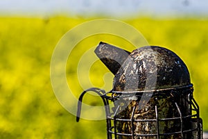 Beekeepers smoker on a beehive