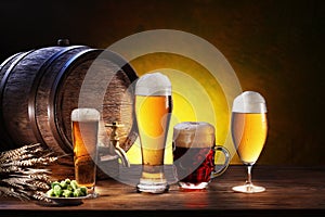 Beer barrel with beer glasses on a wooden table.