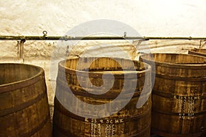 Beer being brewed in an old oak barrel brewery