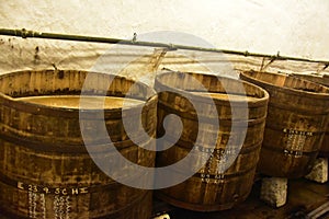 Beer being brewed in an old oak barrel brewery