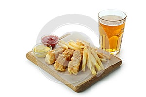 Beer and board with fried fish and chips, and sauces isolated on white background