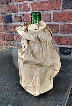 Beer Bottle in a Brown Sac