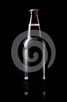 Beer bottle on a dark black background. Bottle with drink like Ipa, Pale Ale, Pilsner, Porter or Stout