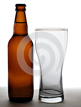 Beer bottle and empty glass
