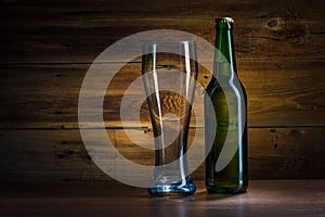 Beer bottle and empty glass