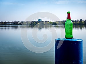 Beer bottle on a mooring bollard