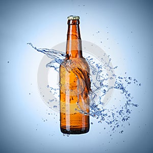 Beer bottle with water splash