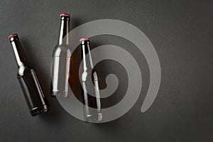 Beer bottles, black concrete, beer bottles, dark background, rustic black, black table, tall brown, 330ml matt, commercial purpose