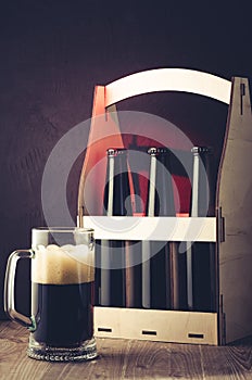 Beer bottles case and mug /beer bottles case and mug on a red li