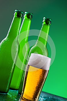 Beer bottles with full glass