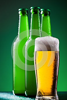 Beer bottles with full glass