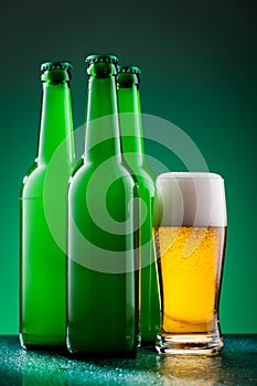 Beer bottles with full glass