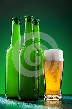 Beer bottles with full glass