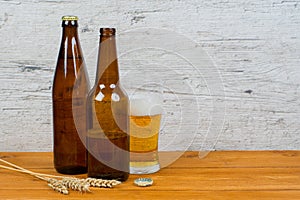 Beer bottles and glass on pub table