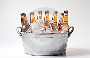 Beer bottles in metal basket with ice cubes on light background for party drink