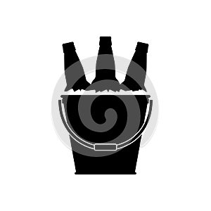 Beer bottles in a metal bucket with ice cubes. Black silhouette on white background. Vector picture and simple icon.