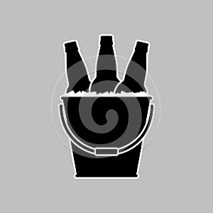 Beer bottles in a metal bucket with ice cubes. Black silhouette with white linear outline. Vector picture and simple icon.