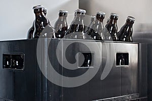 Beer bottles in an old plastic box.