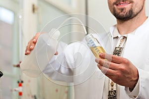 Beer Brewer in food laboratory examining