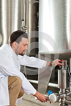 Beer brewer in his brewery
