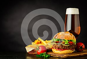 Beer with Burger and French Fries on Copy Space