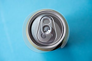 Beer can from above on blue background