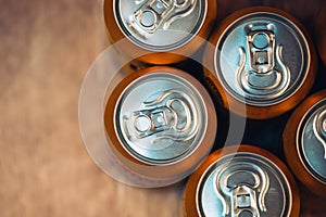 Beer cans on rustic wooden table top view