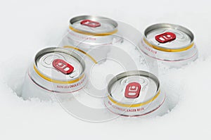 Beer cans in winter snow