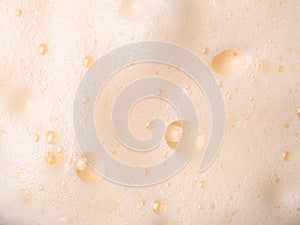 Beer or cappucino foam with bubbles texture