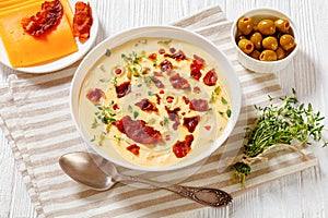 Beer cheese soup in bowl, top view