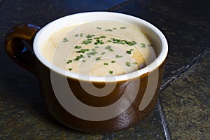 Beer Cheese Soup in Crock with Chives photo