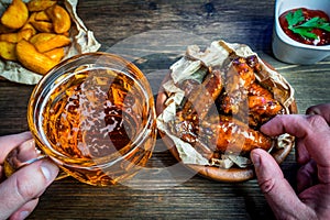 Beer and chicken wings with sesame and soy sauce. place for your text